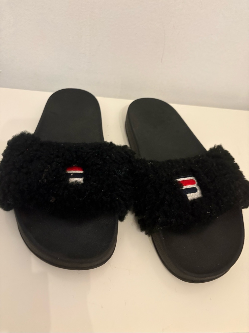 Fila Women's Black Fuzzy Slide Sandals with Red & White Logo